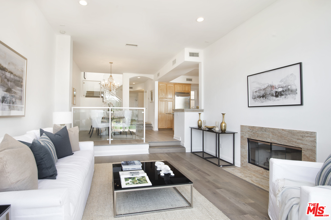 6450 Lunita Road, Unit 122 Malibu, CA 90265 - Photo 4 of 32 a living room with furniture and a fireplace