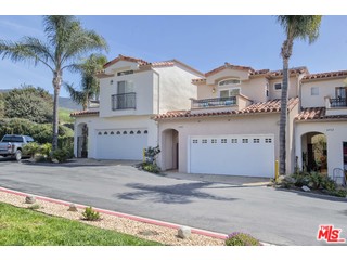 6450 Lunita Road, Unit 122 Malibu, CA 90265 - Photo 31 of 32 a front view of a house with a yard and garage
