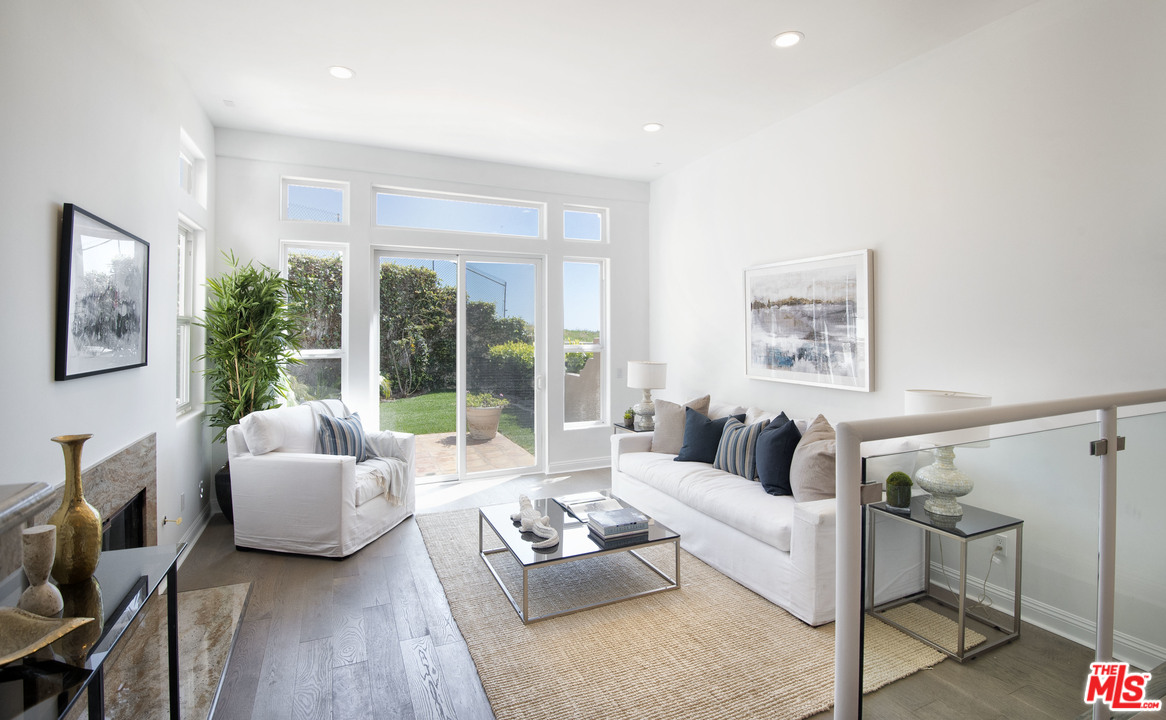 6450 Lunita Road, Unit 122 Malibu, CA 90265 - Photo 6 of 32 a living room with furniture and a large window