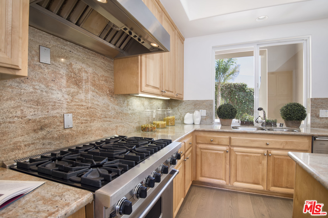 6450 Lunita Road, Unit 122 Malibu, CA 90265 - Photo 8 of 32 a kitchen with a stove a sink and a window