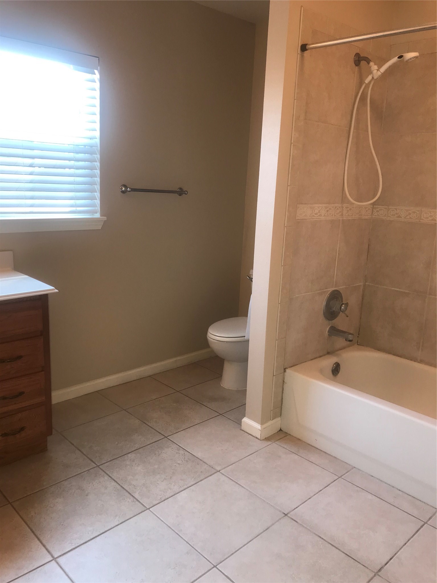 2443 Precinct Line Road Richmond, TX 77406 - Photo 10 of 17 a bathroom with a sink a toilet and bathtub