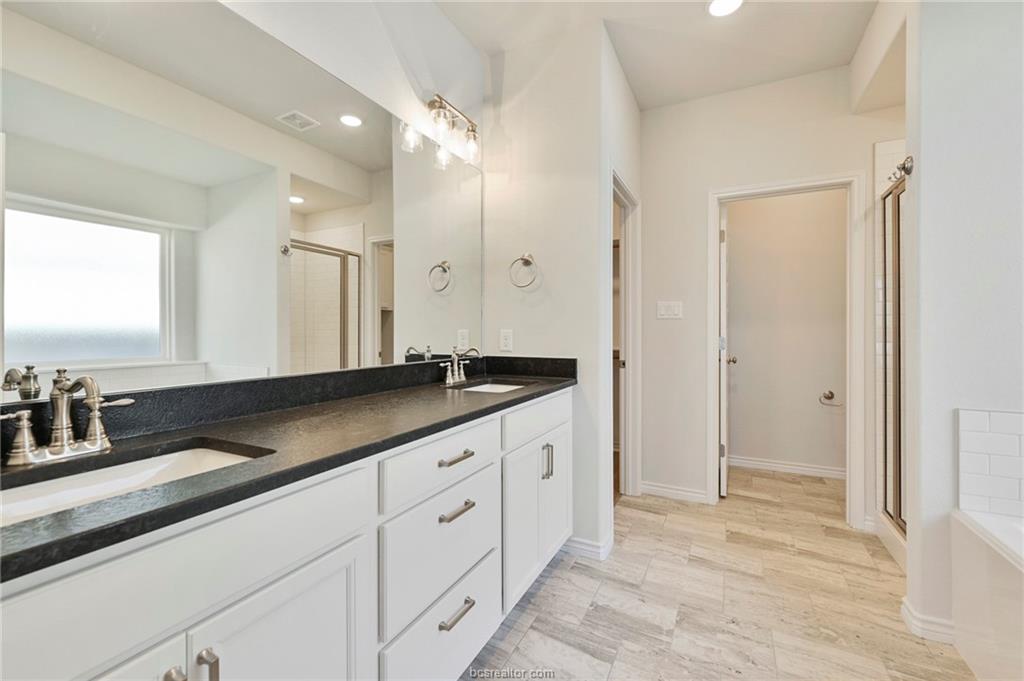 3124 Tarleton Court Bryan, TX 77808 - Photo 12 of 22 a bathroom with a sink and a mirror
