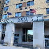 a view of a brick building with many windows