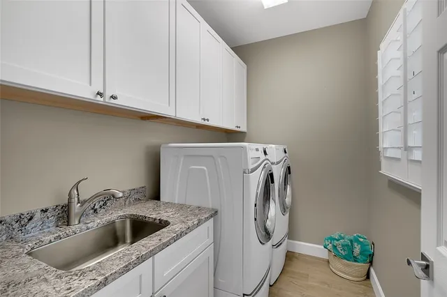 a view of storage and utility room with washer and dryer