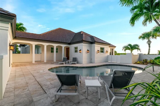 a view of a house with sitting area and furniture
