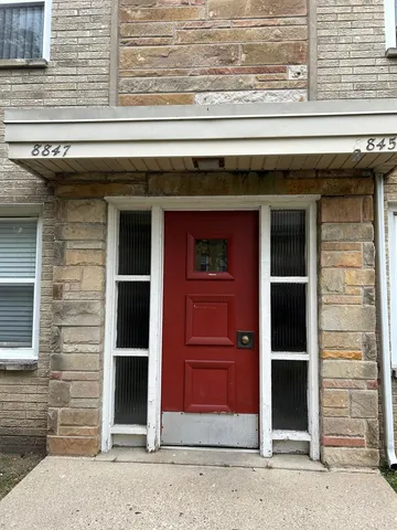 a kitchen with stainless steel appliances granite countertop a sink cabinets and wooden floor
