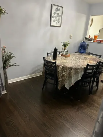 a view of a backyard with a table and chairs