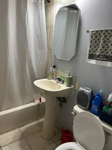 a kitchen with stainless steel appliances granite countertop a sink cabinets a refrigerator and a stove