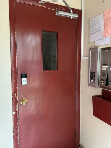a kitchen with refrigerator and window
