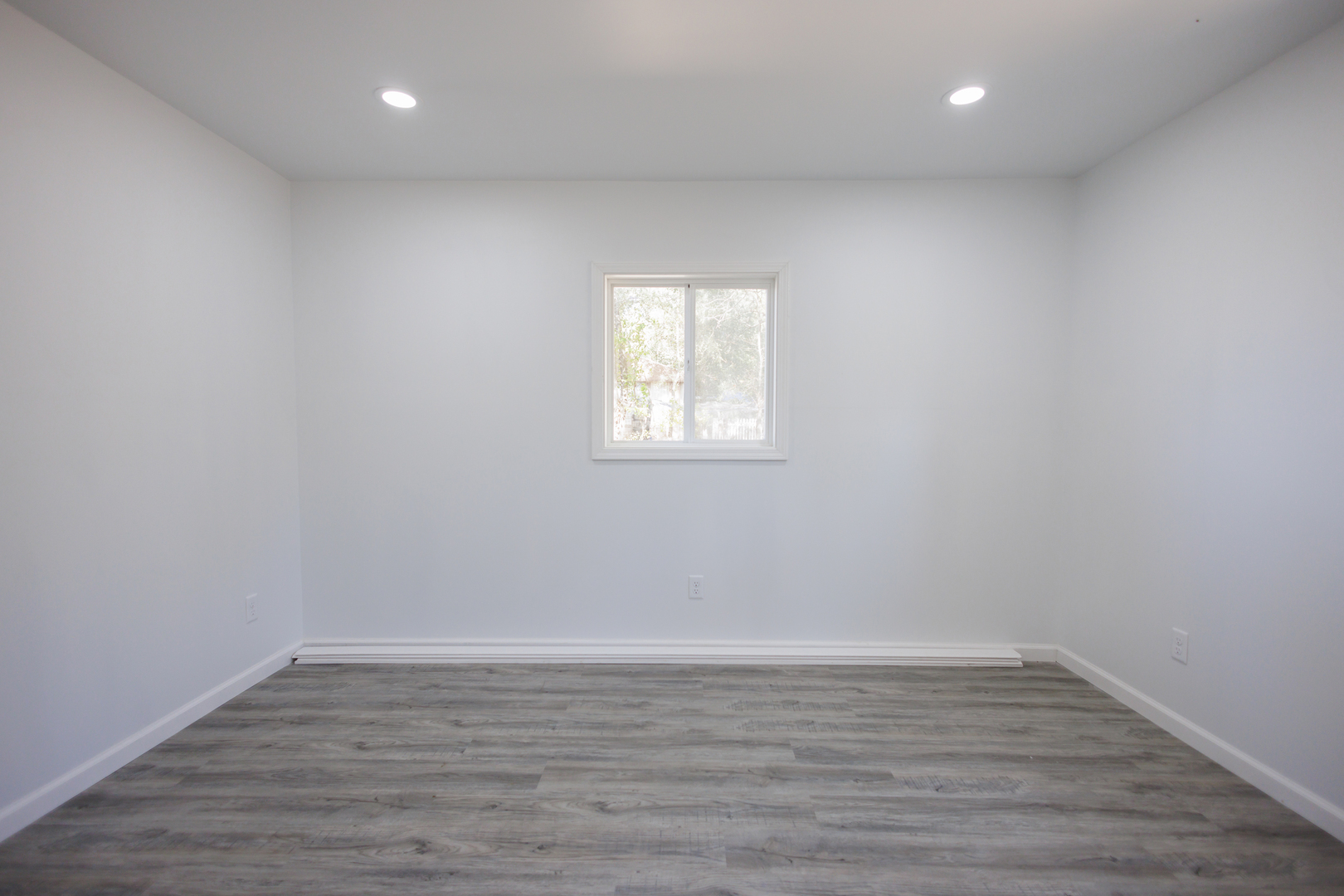 1581 South 16000E Road Pembroke Township, IL 60958 - Photo 11 of 24 wooden floor in an empty room with a window