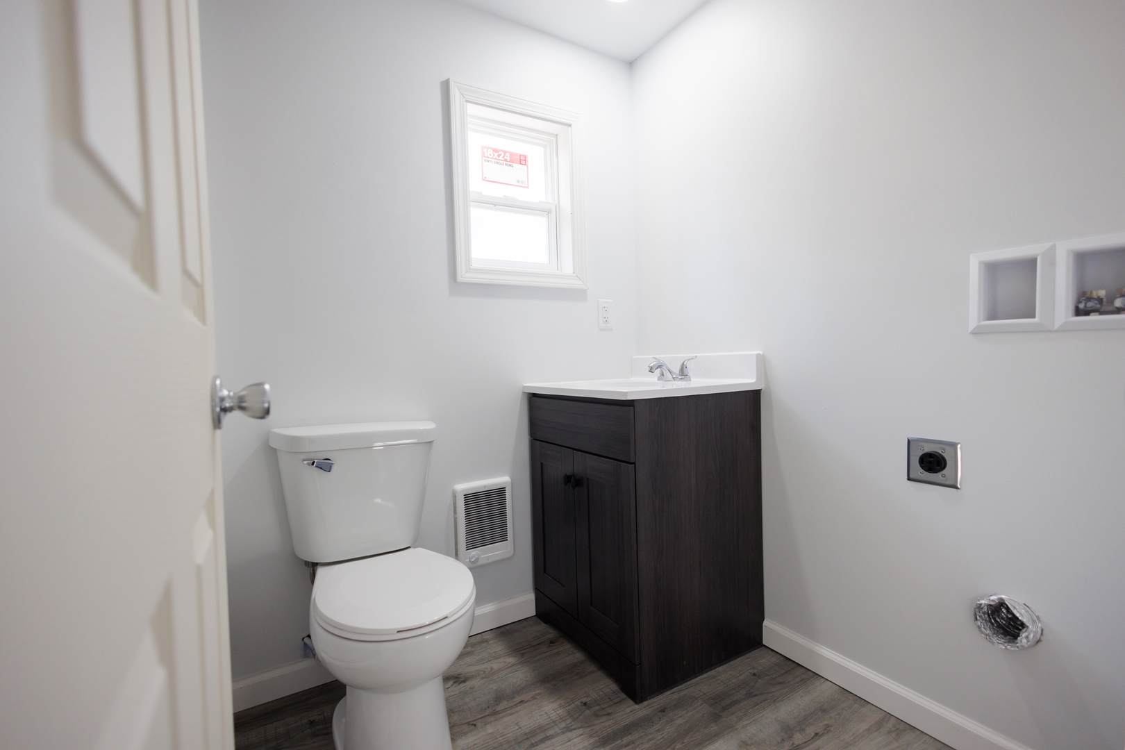1581 South 16000E Road Pembroke Township, IL 60958 - Photo 12 of 24 a bathroom with a toilet sink and mirror