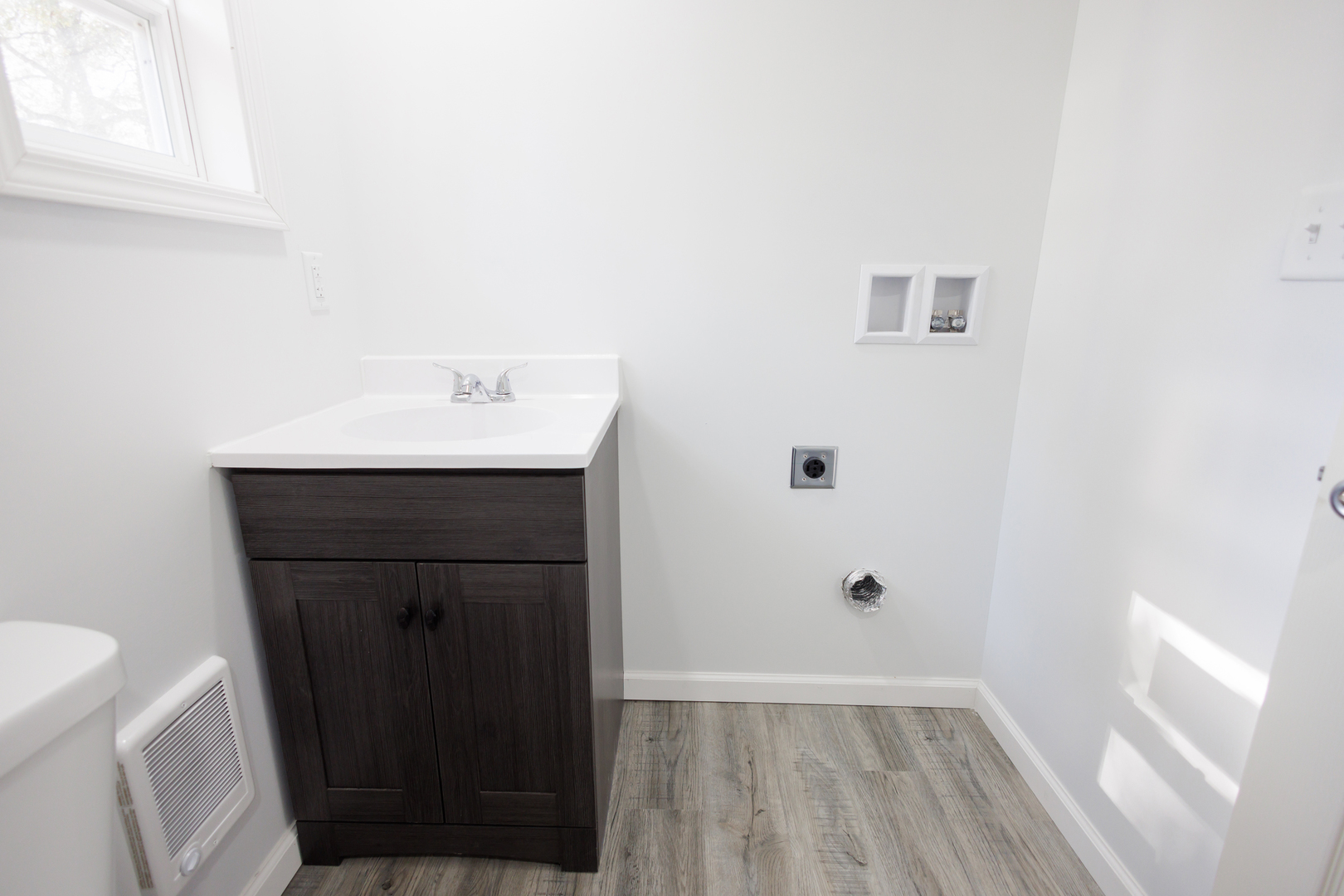 1581 South 16000E Road Pembroke Township, IL 60958 - Photo 13 of 24 a bathroom with a sink a toilet and a window