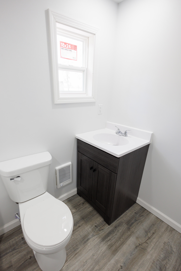 1581 South 16000E Road Pembroke Township, IL 60958 - Photo 14 of 24 a bathroom with a toilet sink and mirror
