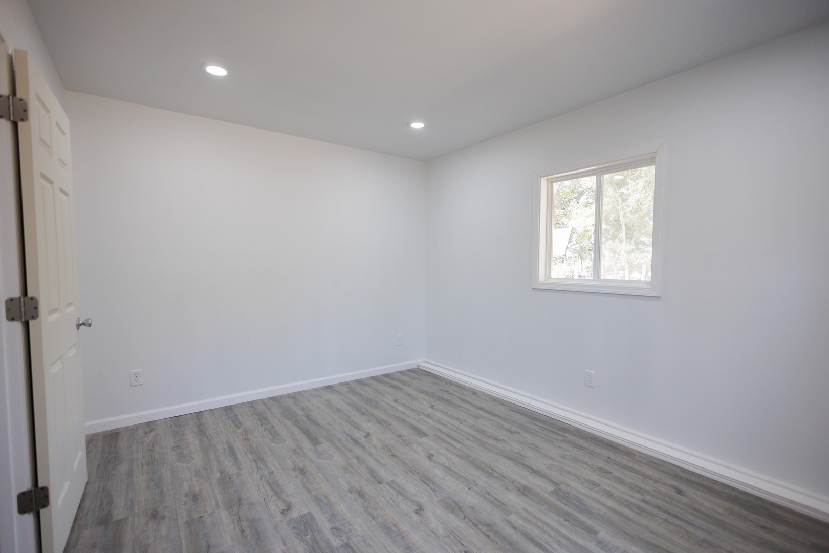 1581 South 16000E Road Pembroke Township, IL 60958 - Photo 19 of 24 an empty room with wooden floor and windows