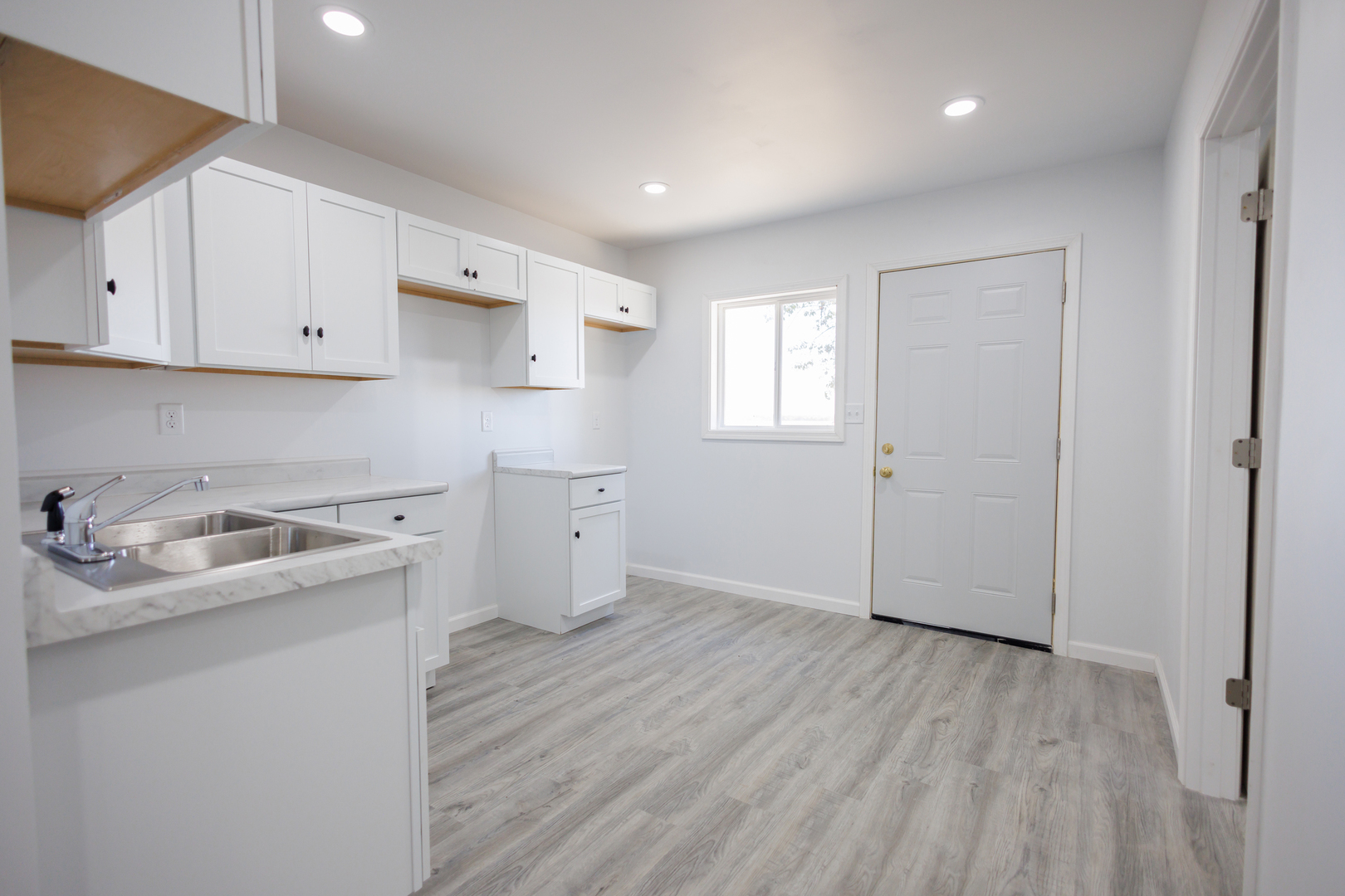 1581 South 16000E Road Pembroke Township, IL 60958 - Photo 5 of 24 a kitchen with a sink a stove and cabinets