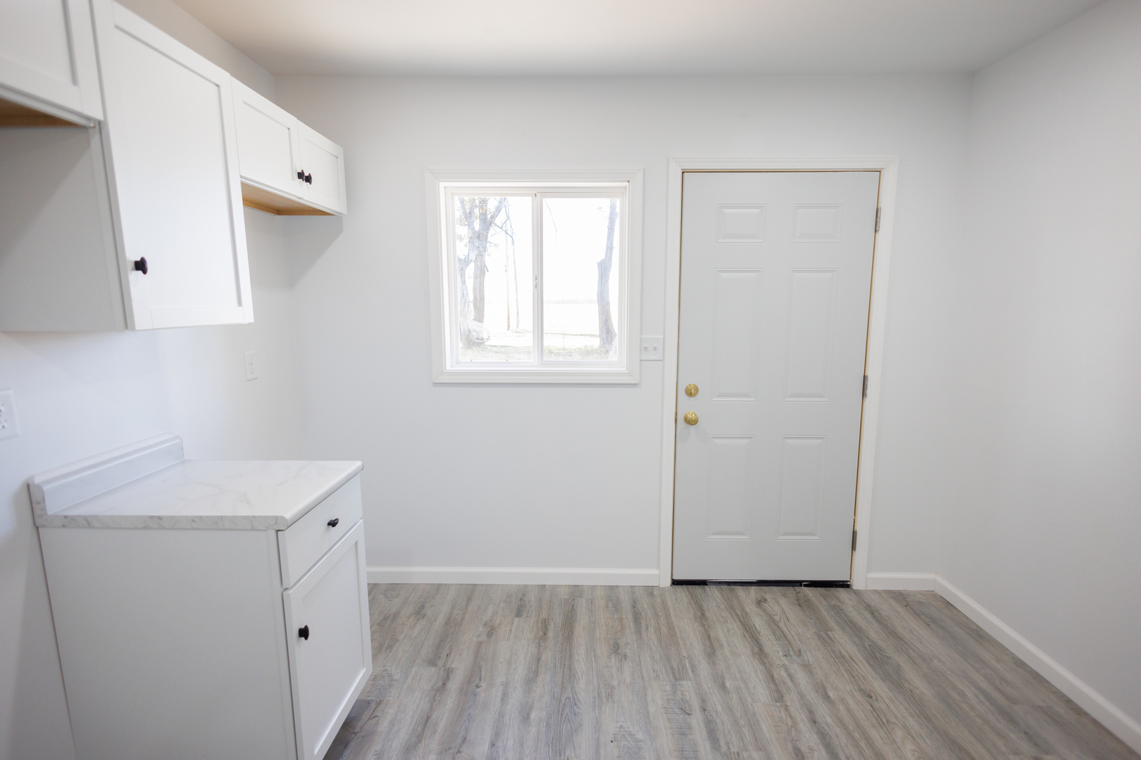 1581 South 16000E Road Pembroke Township, IL 60958 - Photo 7 of 24 a view of a storage and utility room with wooden floor