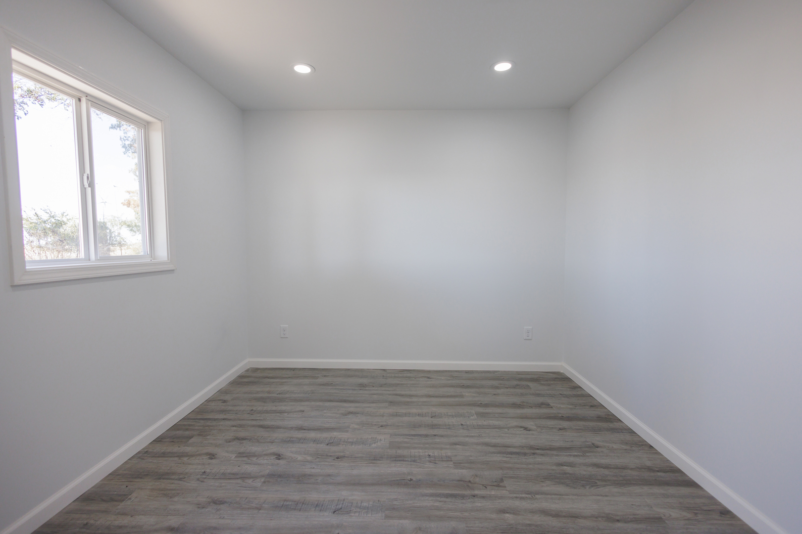 1581 South 16000E Road Pembroke Township, IL 60958 - Photo 8 of 24 wooden floor in an empty room with a window