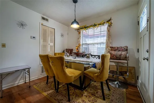 a dining room with furniture and window