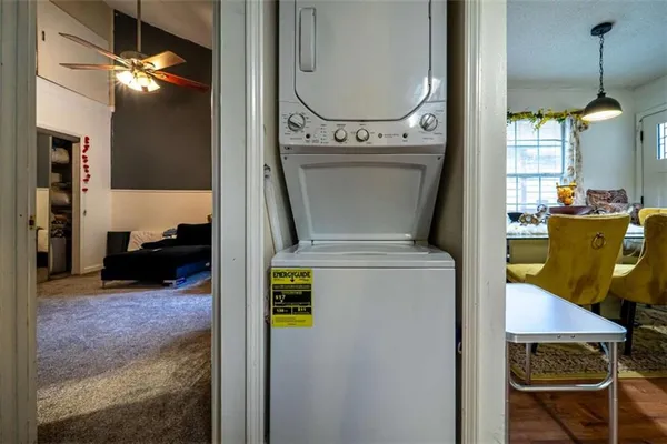 a view of living room with furniture and a chandelier