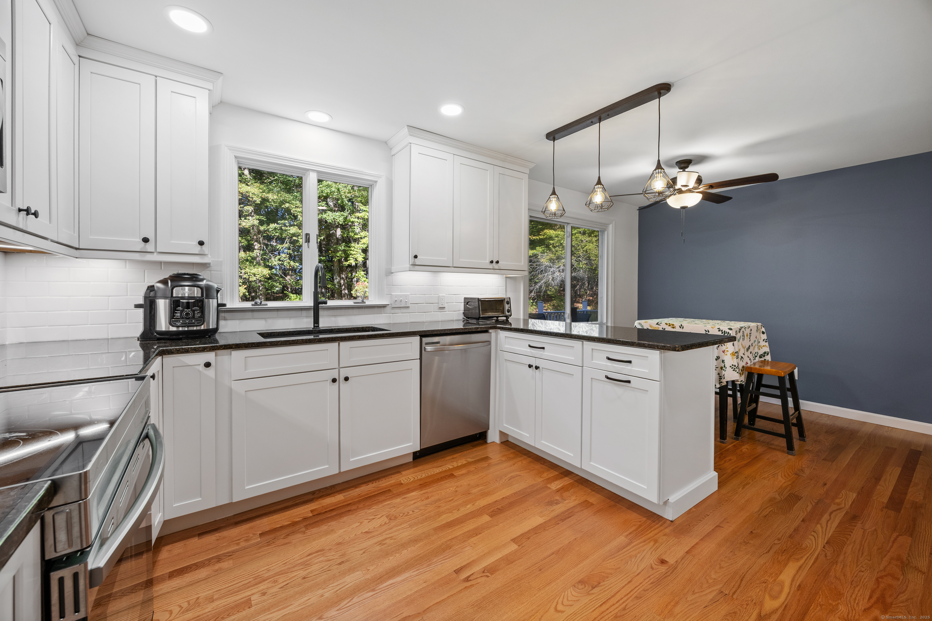 23 Hampden Road Somers, CT 06071 - Photo 6 of 37 a kitchen with a sink cabinets stainless steel appliances and windows
