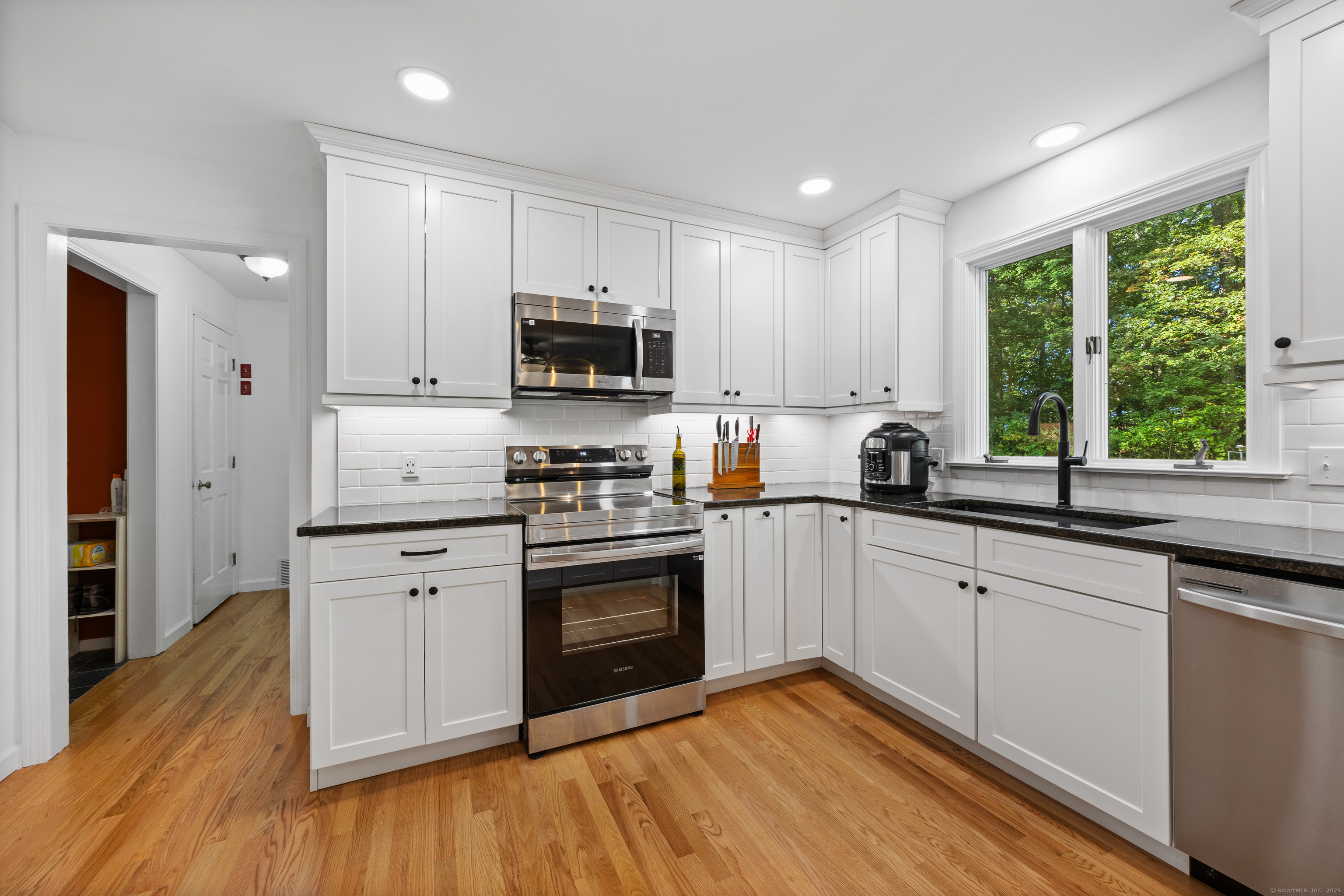 23 Hampden Road Somers, CT 06071 - Photo 7 of 37 a kitchen with a sink a window and appliances