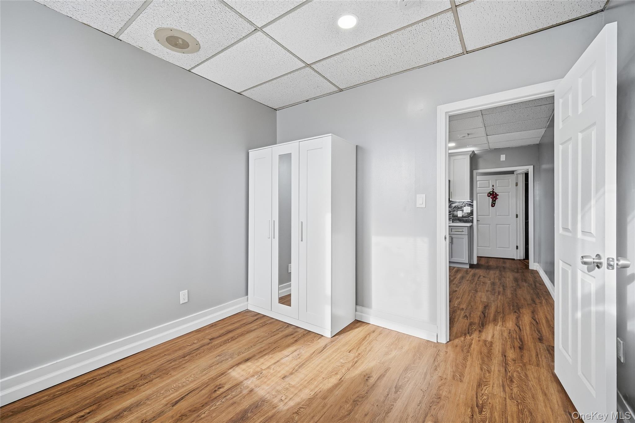 32 B West Main Street, Unit 2 Bay Shore, NY 11706 - Photo 12 of 16 a view of hallway with wooden floor