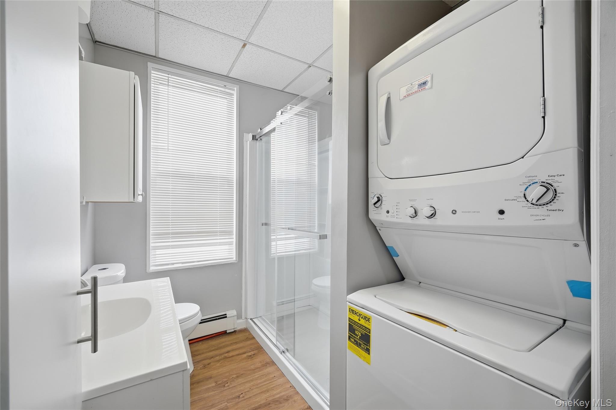 32 B West Main Street, Unit 2 Bay Shore, NY 11706 - Photo 15 of 16 a utility room with dryer and washer
