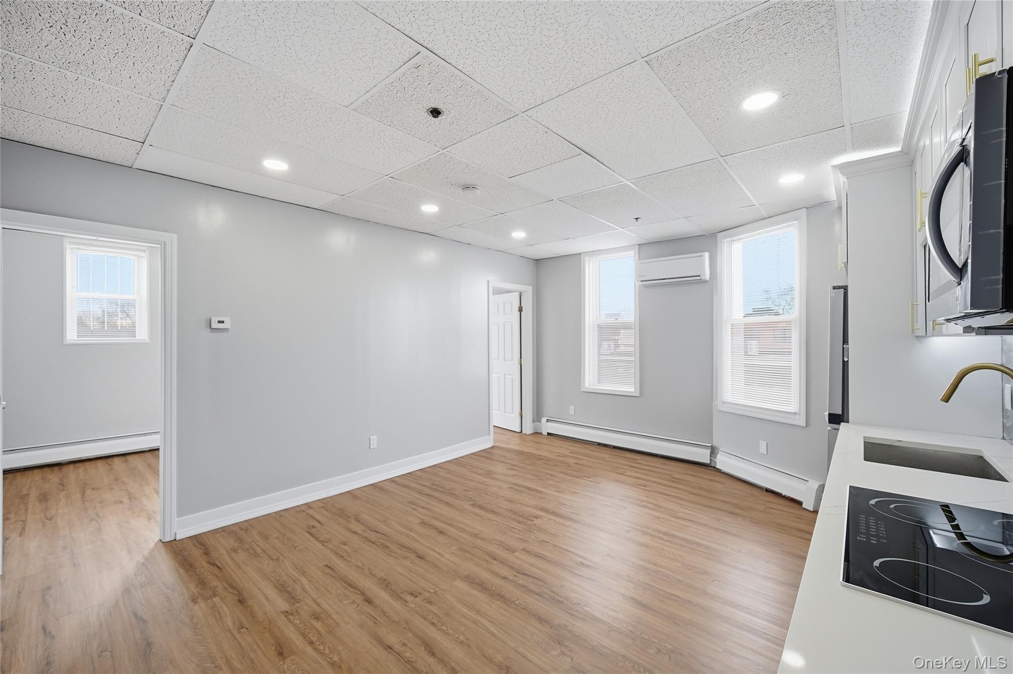 32 B West Main Street, Unit 2 Bay Shore, NY 11706 - Photo 7 of 16 a view of a livingroom with wooden floor