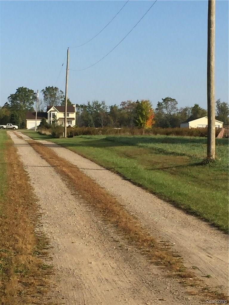9472 Grant Road Fowlerville, MI 48836 - Photo 23 of 26 View of home from road.