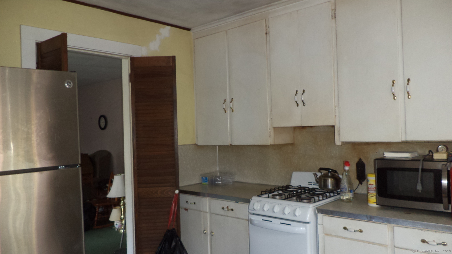 280 Newtown Turnpike Redding, CT 06896 - Photo 10 of 27 a kitchen with stainless steel appliances white cabinets and a refrigerator