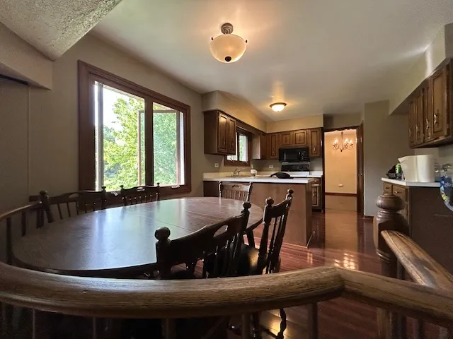 a kitchen with kitchen island a large window