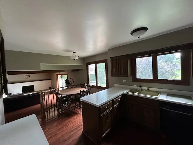 a kitchen with granite countertop a stove and a sink