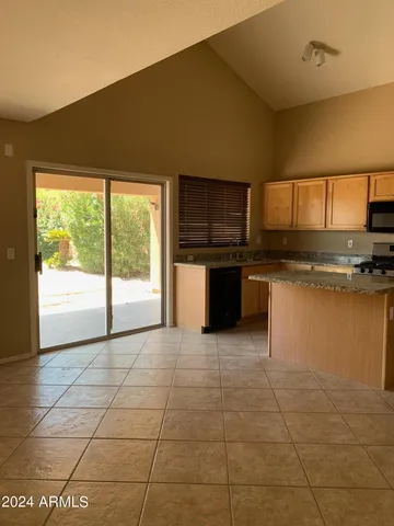 a kitchen with a stove a sink and a microwave