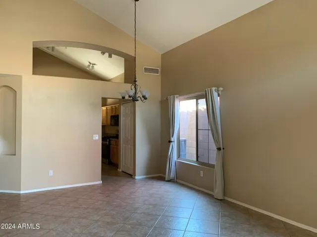 a view of hallway with chandelier