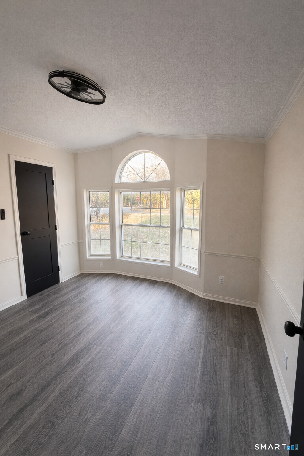 130 Williams Road Montville, CT 06370 - Photo 4 of 5 an empty room with wooden floor and windows
