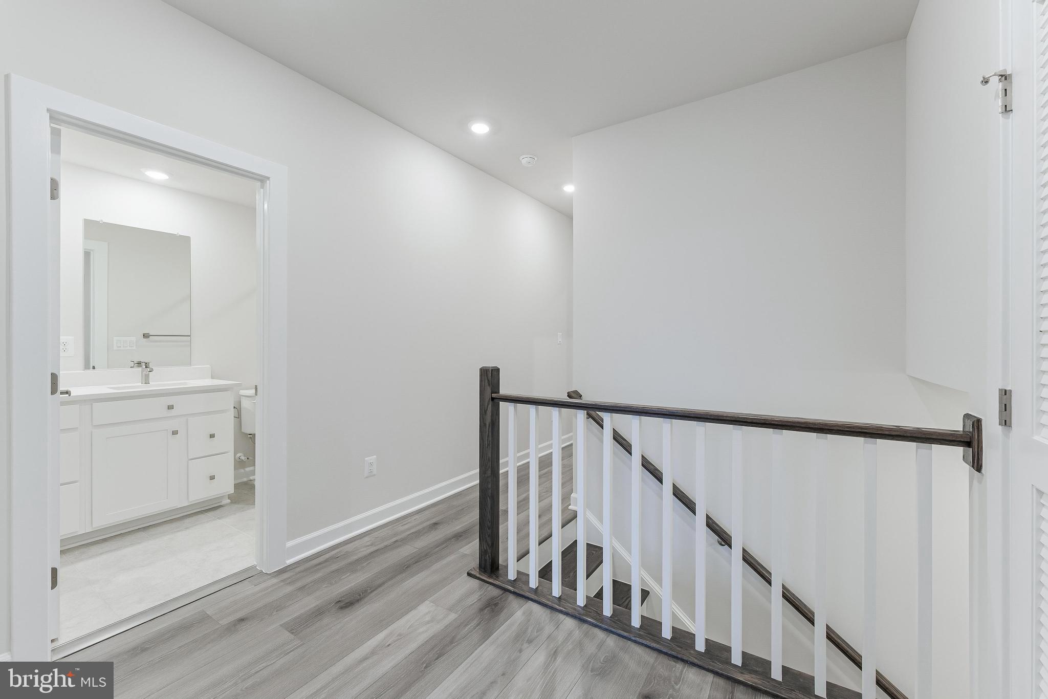 21815 Express Terrace Ashburn, VA 20147 - Photo 14 of 37 a view of a hallway with wooden floor