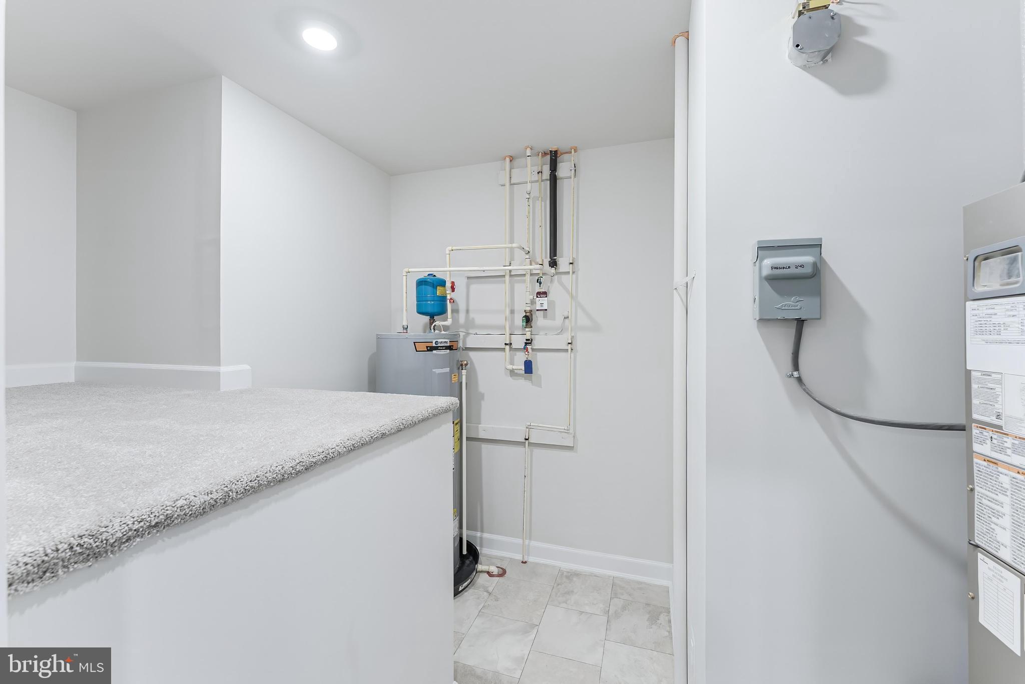 21815 Express Terrace Ashburn, VA 20147 - Photo 17 of 37 a kitchen with a sink and refrigerator