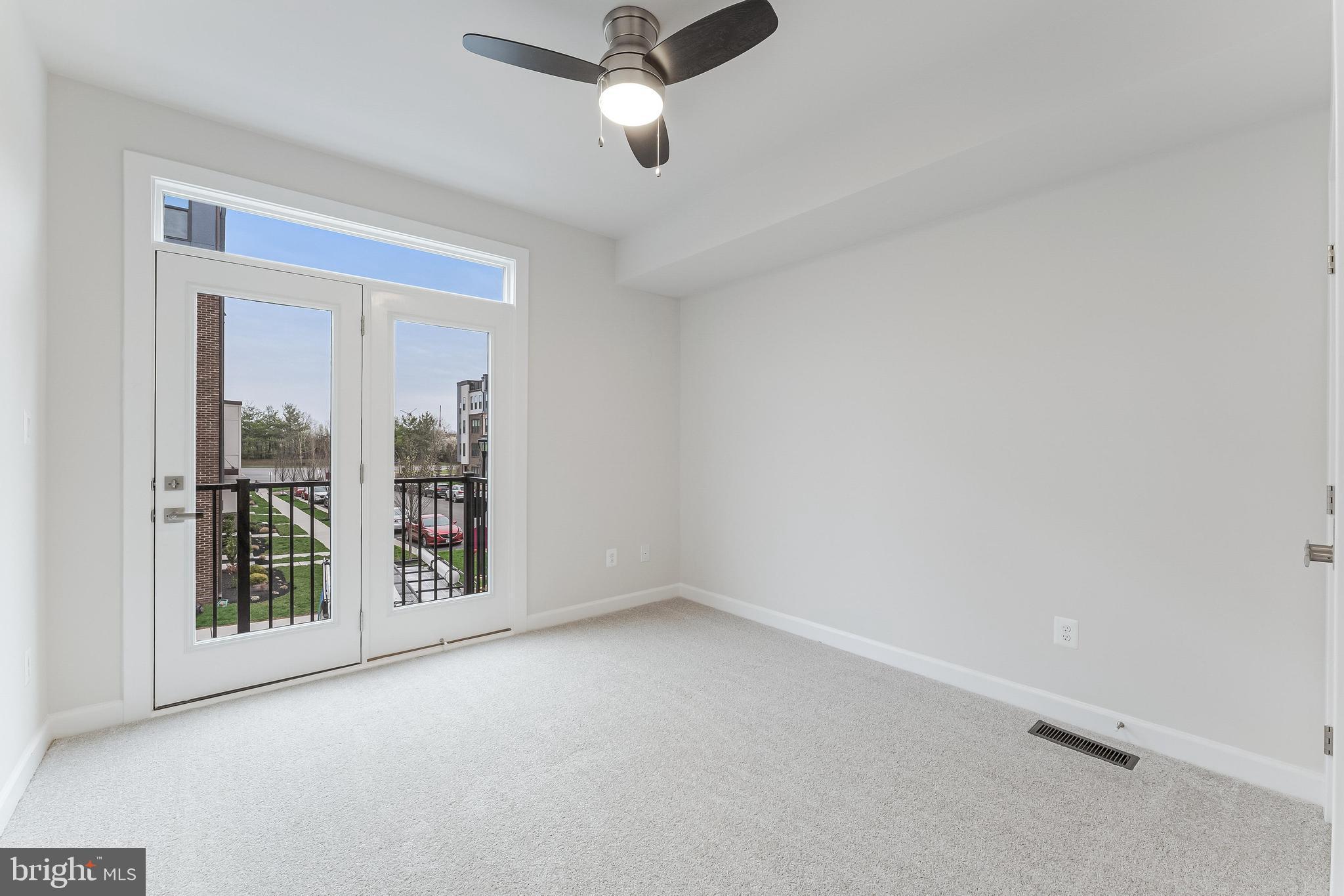 21815 Express Terrace Ashburn, VA 20147 - Photo 24 of 37 an empty room with windows and ceiling fan