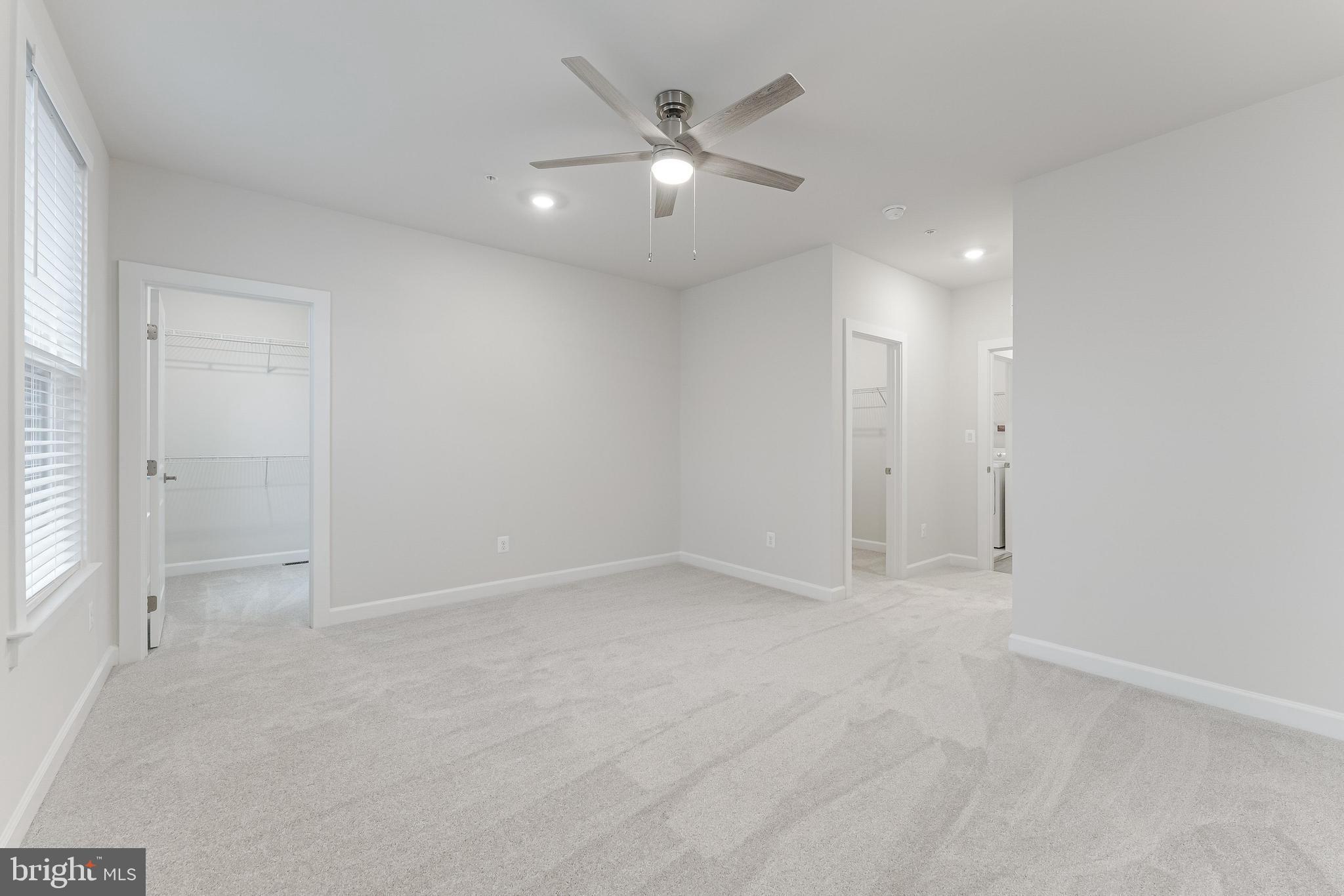 21815 Express Terrace Ashburn, VA 20147 - Photo 29 of 37 an empty room with closet and ceiling fan