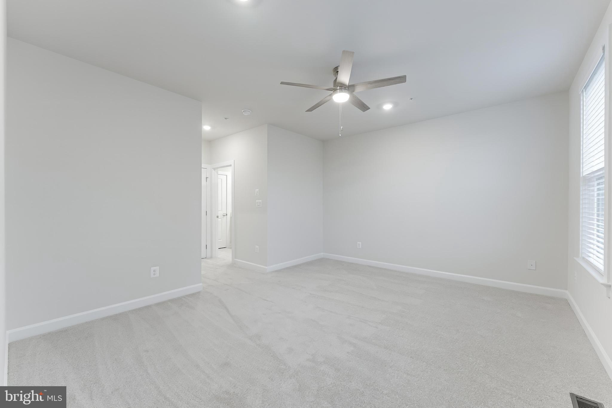 21815 Express Terrace Ashburn, VA 20147 - Photo 30 of 37 an empty room with a window and ceiling fan