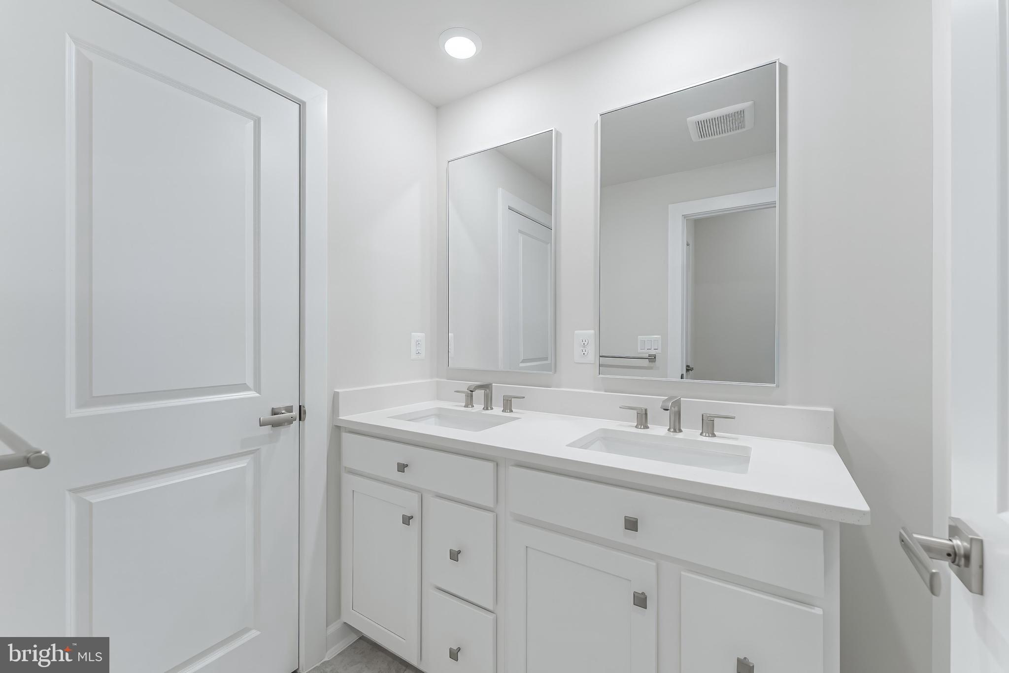 21815 Express Terrace Ashburn, VA 20147 - Photo 33 of 37 a bathroom with 2 sink and a mirror