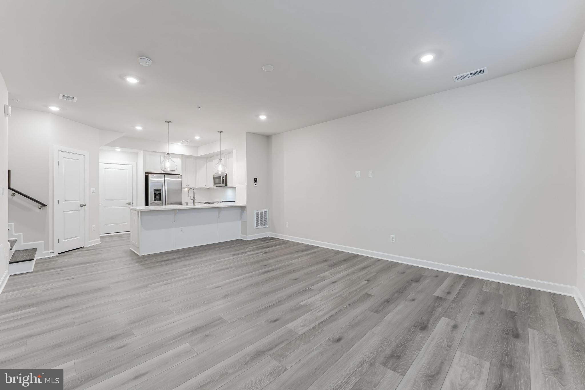 21815 Express Terrace Ashburn, VA 20147 - Photo 8 of 37 a view of kitchen with wooden floor and window