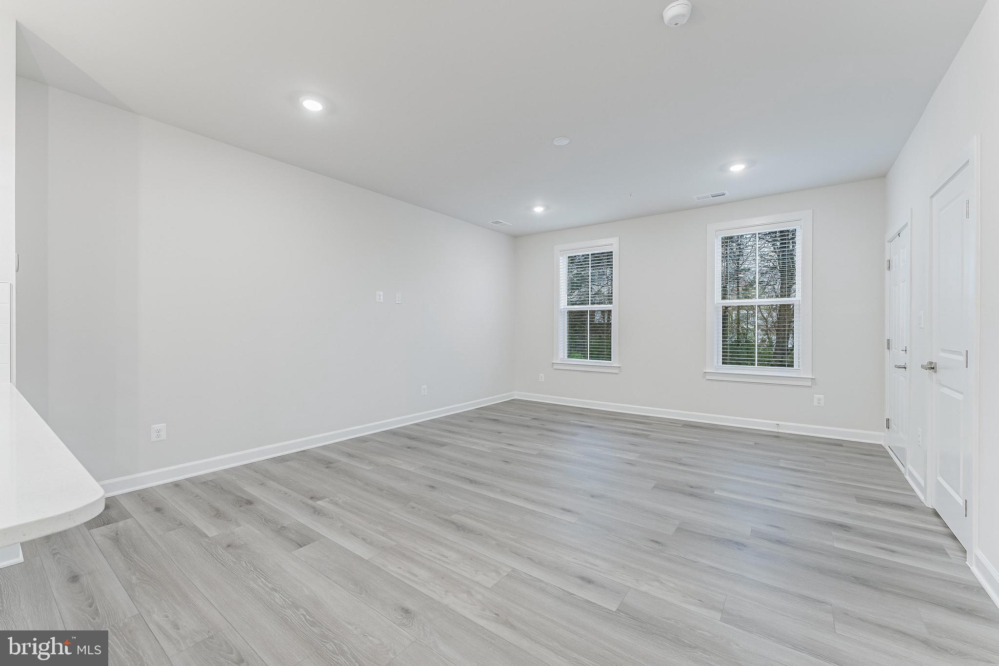 21815 Express Terrace Ashburn, VA 20147 - Photo 9 of 37 an empty room with wooden floor and windows