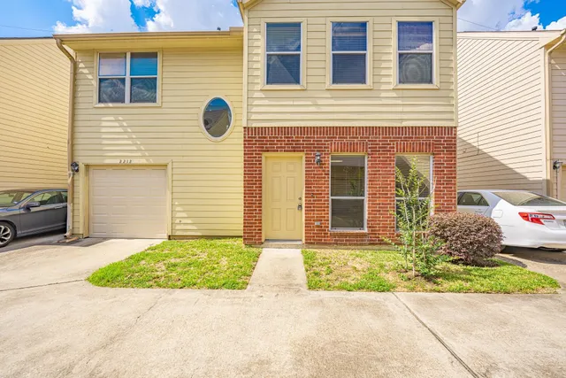 a front view of a house having yard