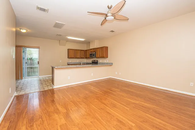 a view of a kitchen with microwave and cabinets