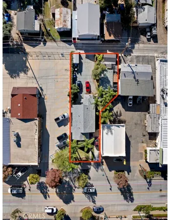 an aerial view of residential houses with outdoor space