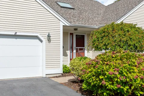 a view of a wooden door and chair