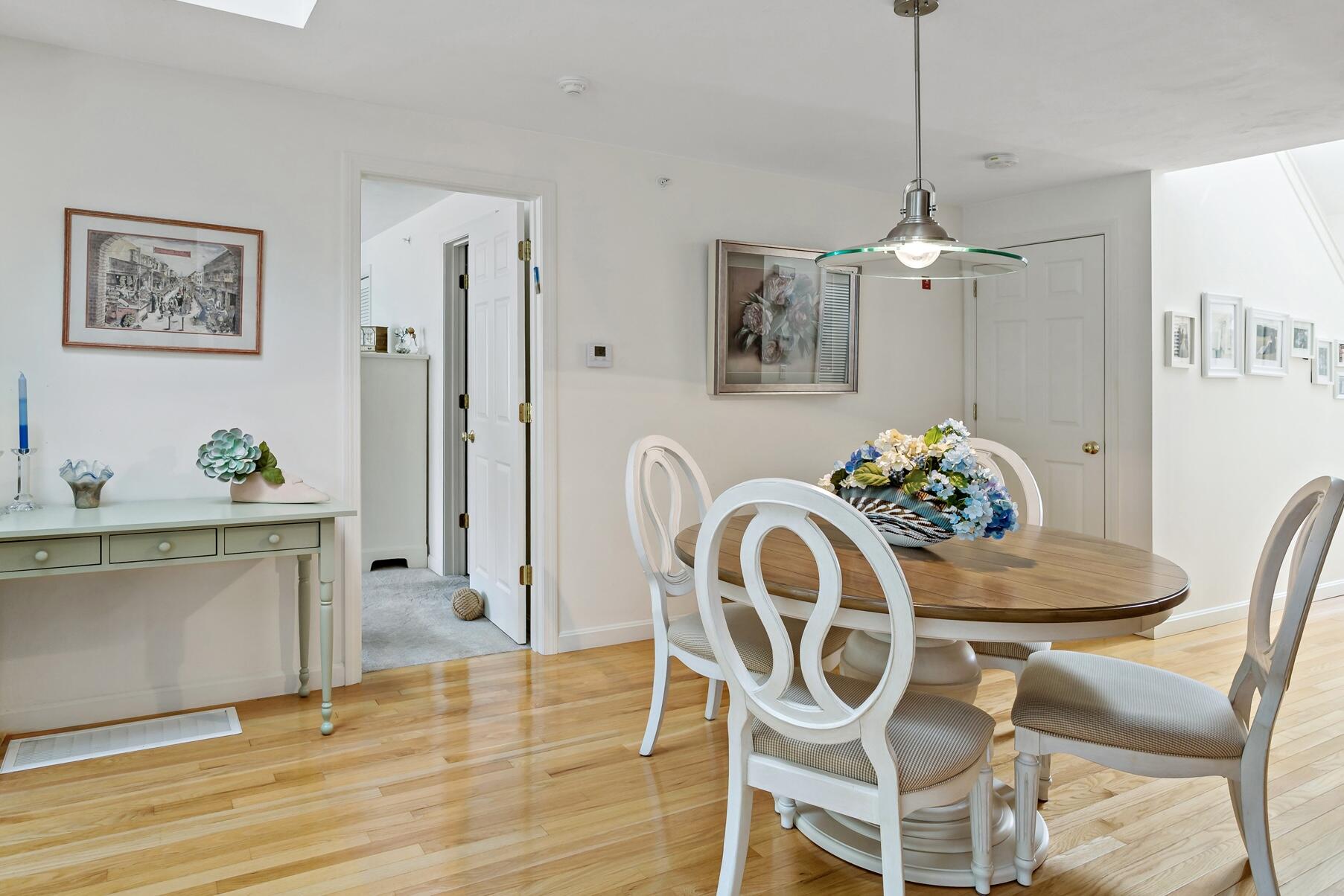 8 Chippers Lane Mashpee, MA 02649 - Photo 12 of 36 a view of a dining room with furniture and wooden floor
