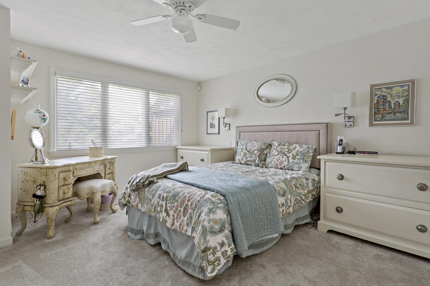 8 Chippers Lane Mashpee, MA 02649 - Photo 13 of 36 a bedroom with a bed and a chandelier