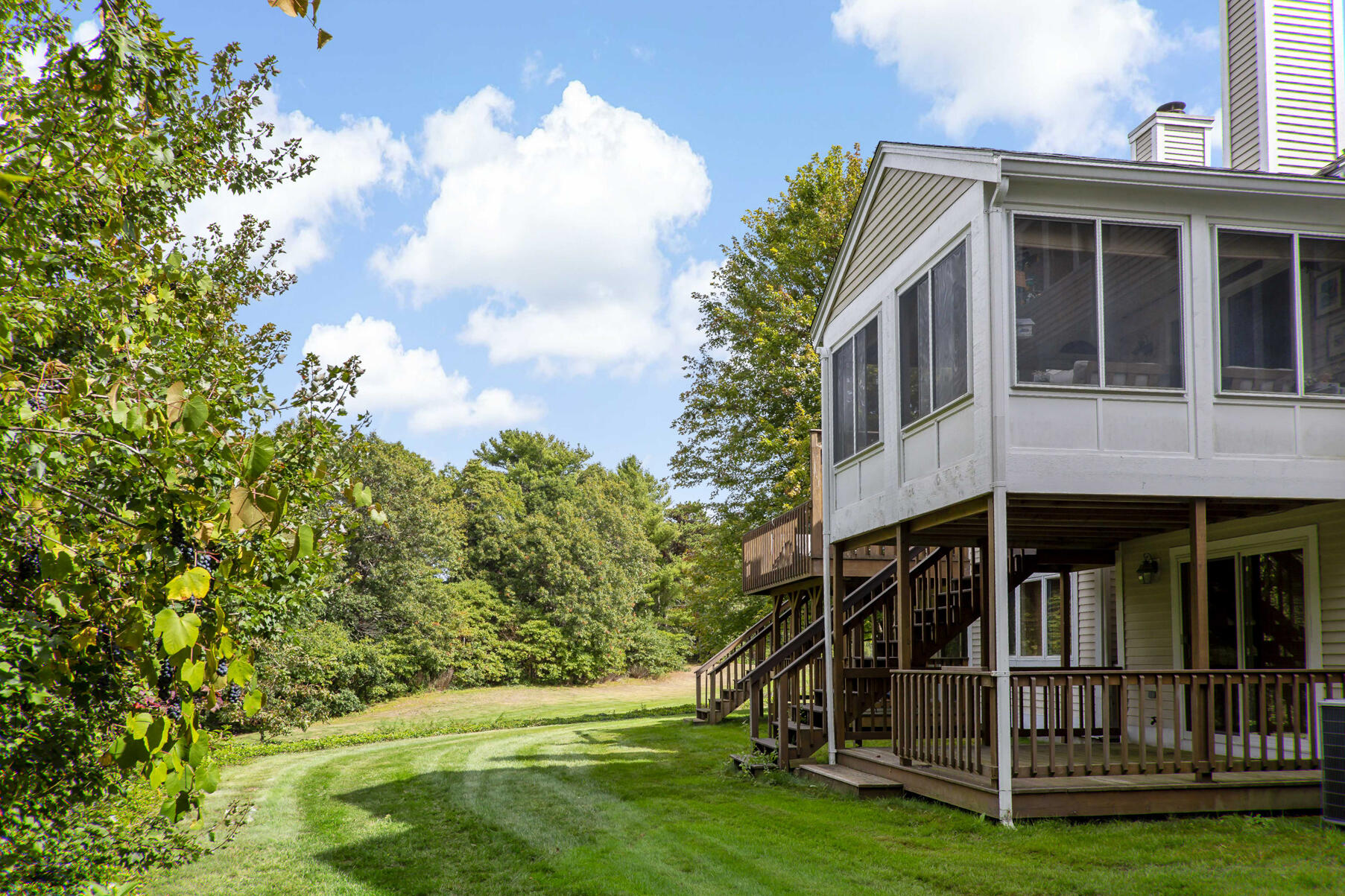 8 Chippers Lane Mashpee, MA 02649 - Photo 24 of 36 a view of small house with yard in front of it